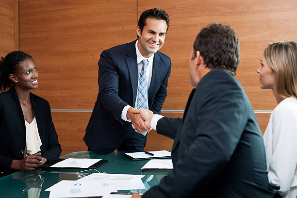 istock Business men shaking hands in office meeting 482545163
