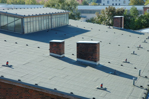 Industrial building's roof covered with roofing paper