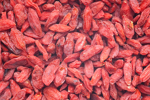 Lot of dray red goji berrys. Goji berrys are very healthy fruits with lot vitamin. Macro Picture.