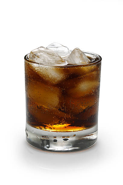 istock Glass of cola with ice on white background 482547150