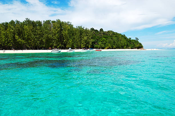 istock Beach with motor boats on turquoise water 482547181