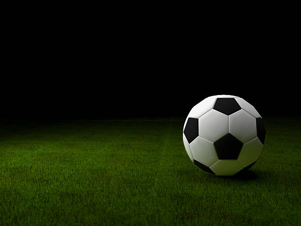 istock Soccer ball on green grass background 482547274