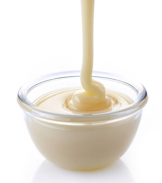istock pouring condensed milk with sugar in a bowl 482548007