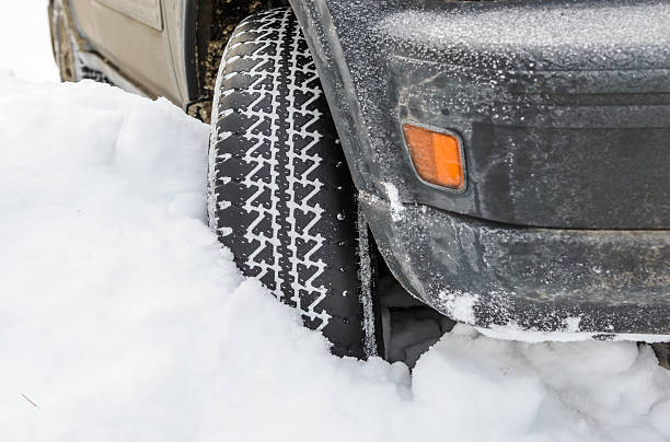 istock wheel in deep winter snow snowbank 482548185