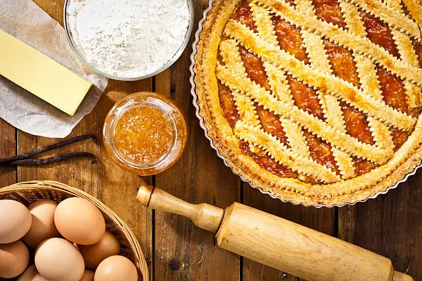 Photo of Homemade italian crostata with ingredients shot directly above