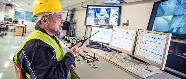 istock Panoramic shot of technician in control room 482550140