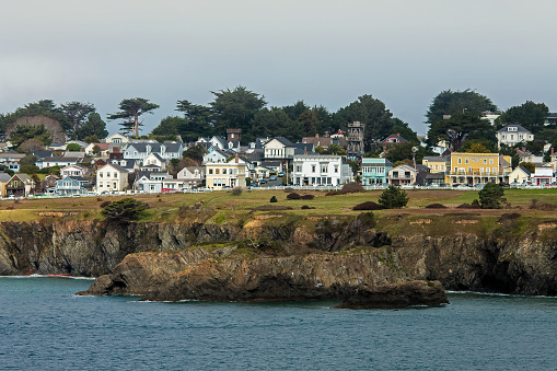 Fog and wind roll over the coastal village of Mendocino on the Pacific Ocean in northern California.