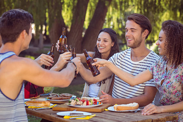 istock Happy friends in the park having lunch 482550480