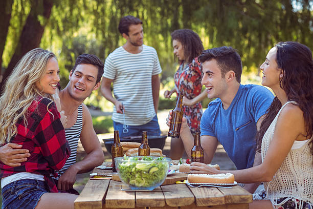 istock Happy friends in the park having lunch 482551176