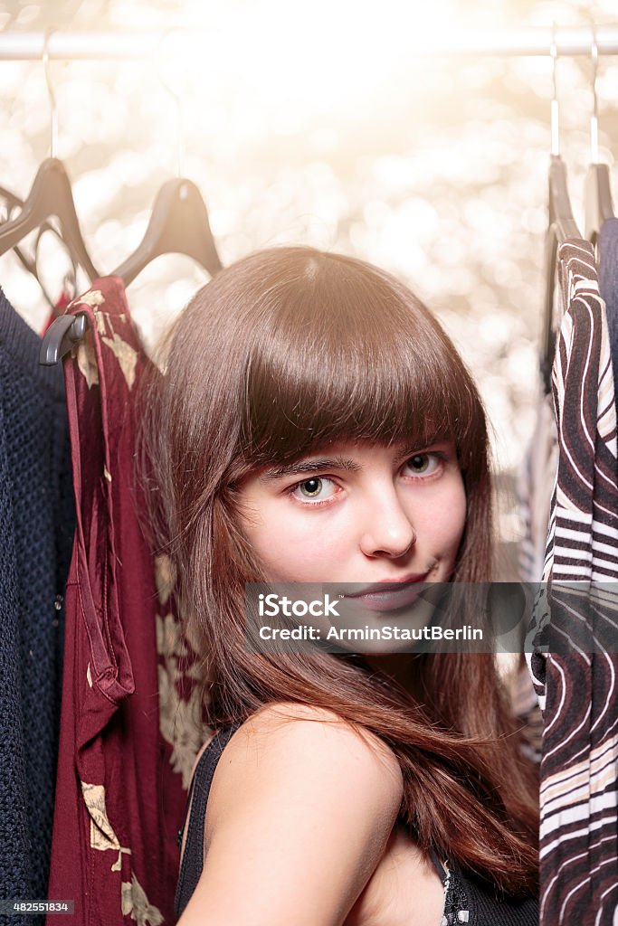 teenage girl and her wardrobe, with bokeh portrait of a beautiful teenage girl and her wardrobe, with bokeh Shopping Stock Photo