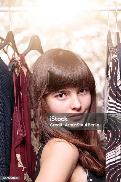 Teenage Girl And Her Wardrobe With Bokeh Stock Photo - Download Image Now - Shopping, Teenage Girls, Teenager