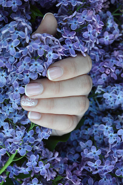 istock Hand with manicure and lilac 482551854