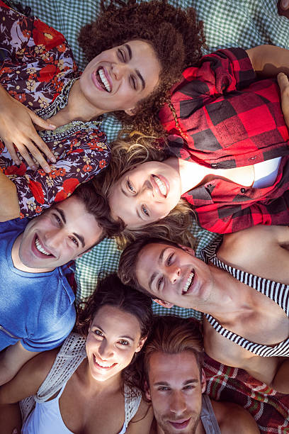 istock Happy friends in the park having picnic 482551860