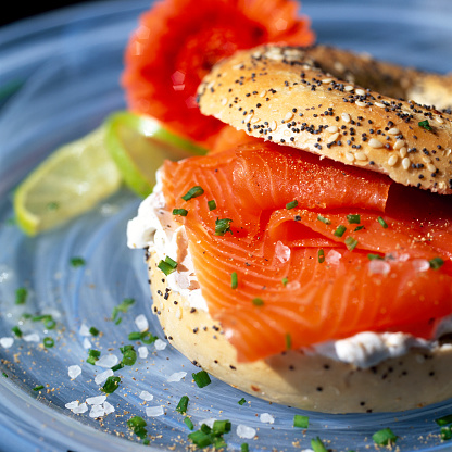 Smoked Salmon and Cream Cheese in a Seeded Fresh Sliced Bagel, healthy eating, for breakfast, lunch, brunch, snack, healthy option food, isolated against a white plain background, clipping path, cut out