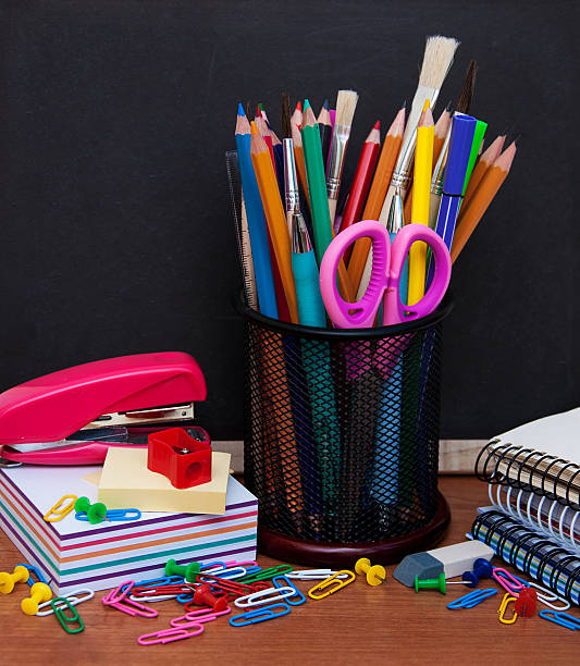 istock school supplies and blackboard 482552320