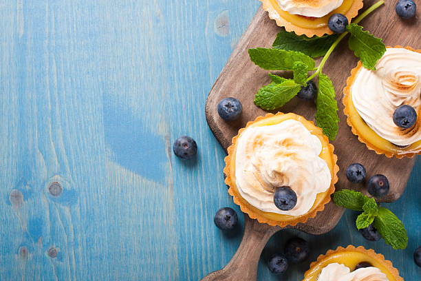 istock Mini lime curd tartlets with meringue. 482552360