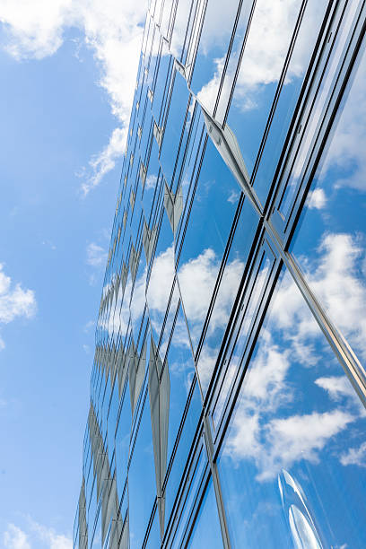 istock sky and clouds mirroring in a glass facade 482556206
