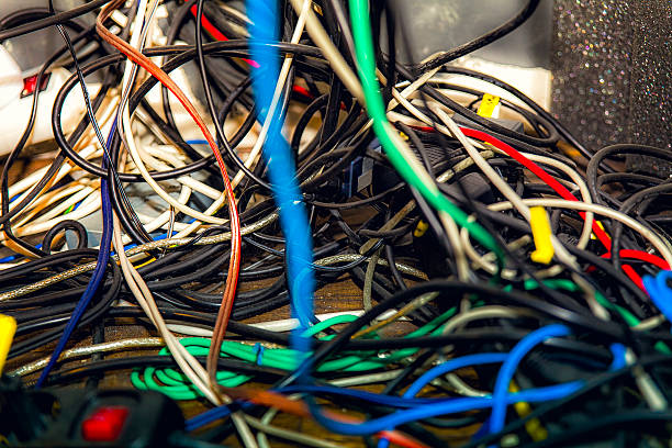 Tangled Cables A mess of wires and cables tangled together. in bounds stock pictures, royalty-free photos & images