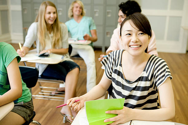 Students studying in classroom stock photo