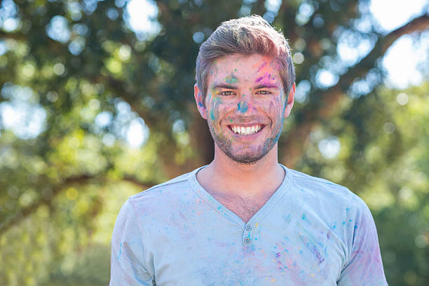 istock Happy man covered in powder paint 482557820