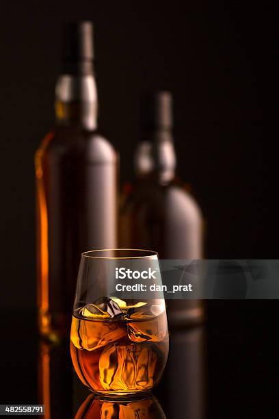 Whiskey And Bottles Stock Photo - Download Image Now - Alcohol - Drink, Amber, Bottle