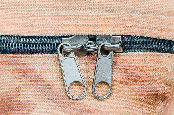 istock Closeup of zipper on old fabric texture 482558819
