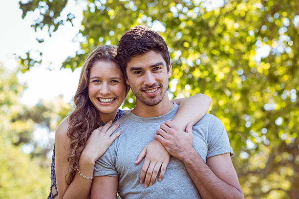 istock Cute couple in the park 482558992