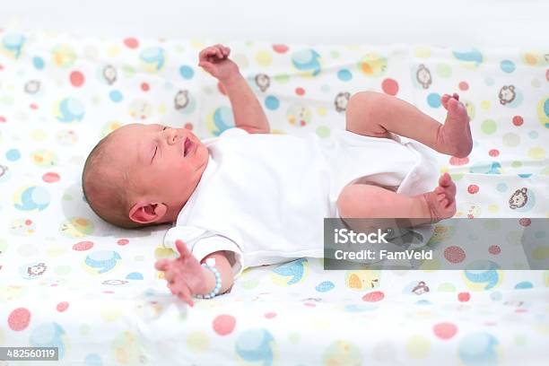 Tiny Newborn Baby On A Changing Table Stock Photo - Download Image Now - Babies Only, Baby - Human Age, Baby Clothing