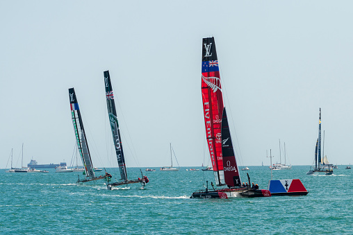 Portsmouth, UK - July 25, 2015: The Team Emirates, Land Rover BAR, and Groupama America's Cup boats sailing in the America's Cup World Series qualifiers in Portsmouth shown on July 25, 2015 in Portsmouth, UK