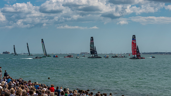 Portsmouth, UK - July 25, 2015: The Team Emirates, Land Rover BAR, Groupama, Team Oracle, and Softbank America's Cup boats sailing in the America's Cup World Series qualifiers in Portsmouth shown on July 25, 2015 in Portsmouth, UK