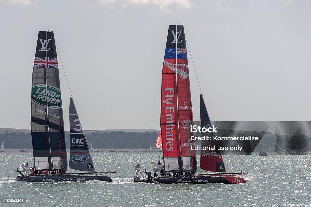 Team Emirates and Land Rover BAR America's Cup boats Portsmouth, UK - July 25, 2015: The Team Emirates and Land Rover BAR America's Cup boats sailing in the America's Cup World Series qualifiers in Portsmouth shown on July 25, 2015 in Portsmouth, UK America's Cup Stock Photo