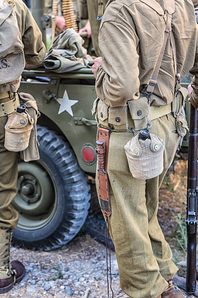 istock US Army World War II Willys Jeep and Waiting Soldiers 482563854