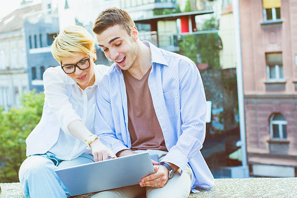 istock Young people with a laptop outdoors 482563896