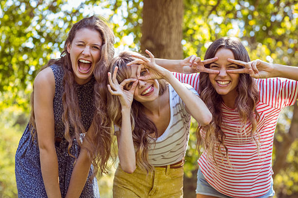 Happy friends taking a selfie on a summers day