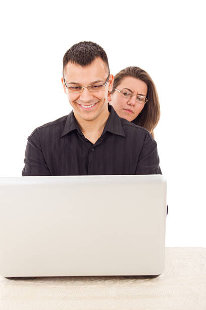 istock women spying on men while chatting over the internet 482565243