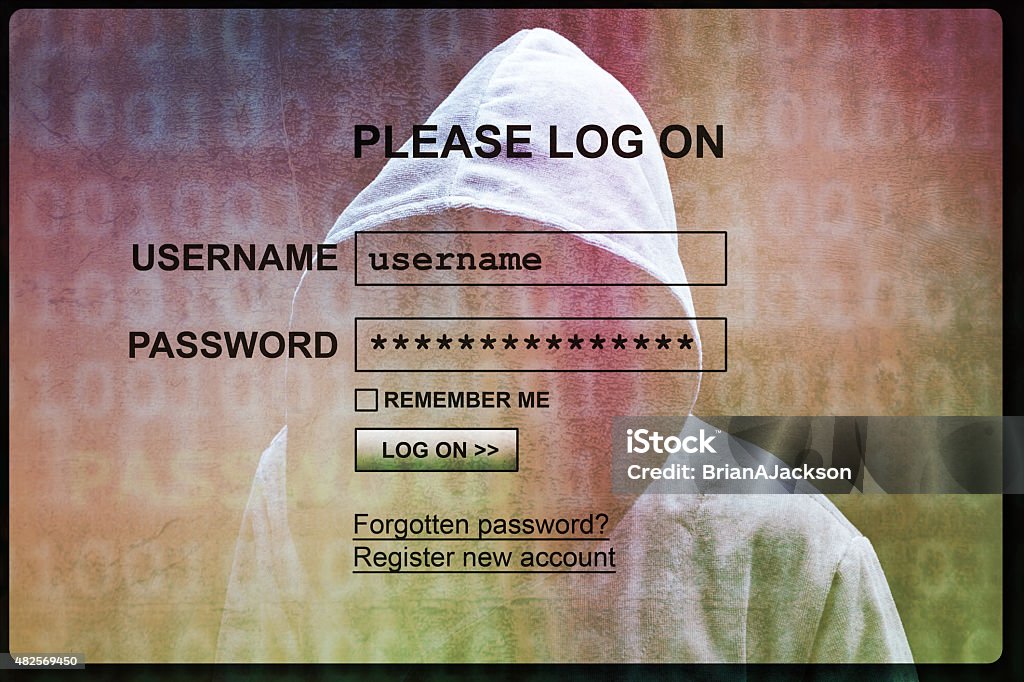 Internet login screen with silhouette of a hacker Computer hacker silhouette of hooded man with internet login screen concept for security, phishing and hacking network account username and password Phishing Stock Photo