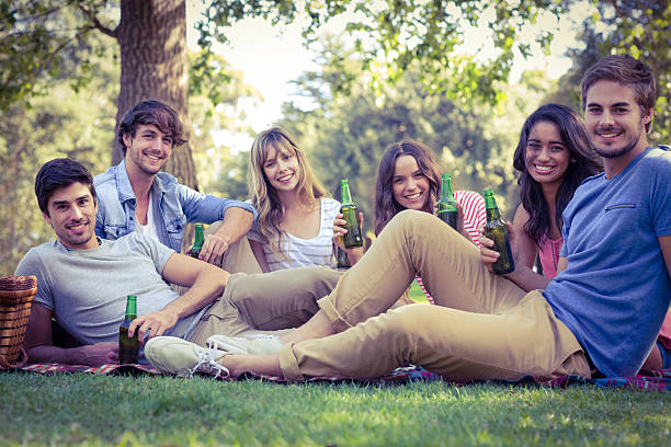 istock Happy friends in the park having picnic 482569542