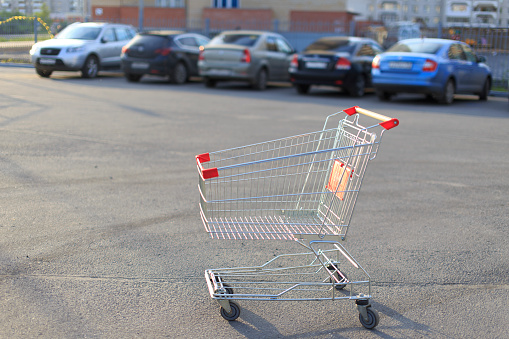 the shopping cart left in the Parking lot of the store