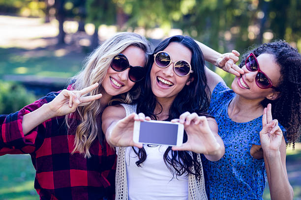 istock Happy hipsters taking a selfie in the park 482569892