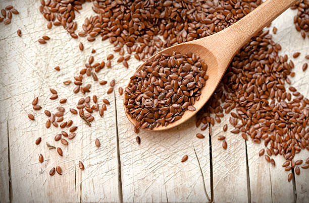 istock flax seeds and wooden spoon 482569984