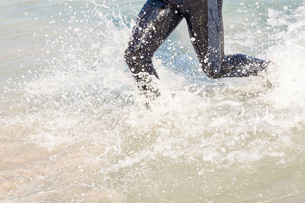 istock Swimmer running in the ocean 482570608