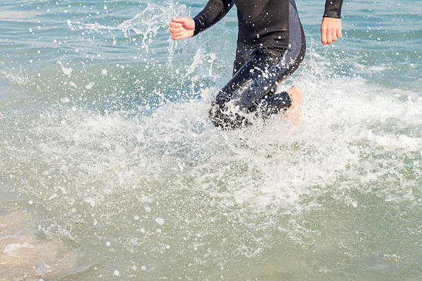istock Swimmer running in the ocean 482570630