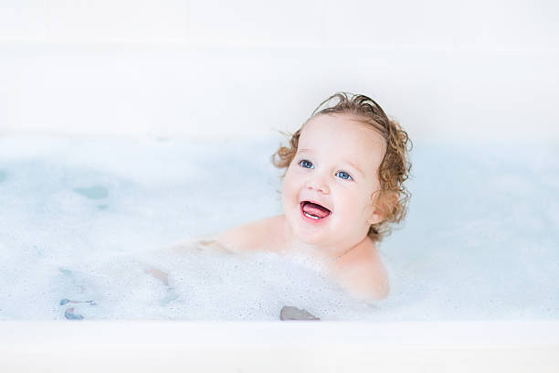 istock Funny toddler girl having a bath with foam 482572103