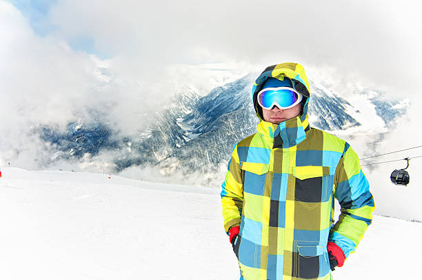 istock Young male wearing winter snowboarding costume 482572189