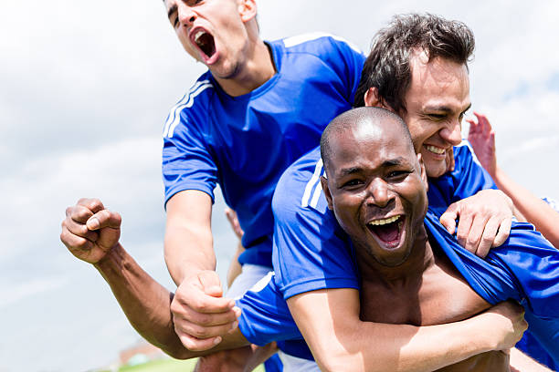istock Football team celebrating a goal 482572533