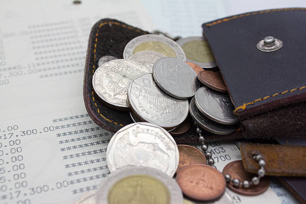istock money bag and coins 482572733