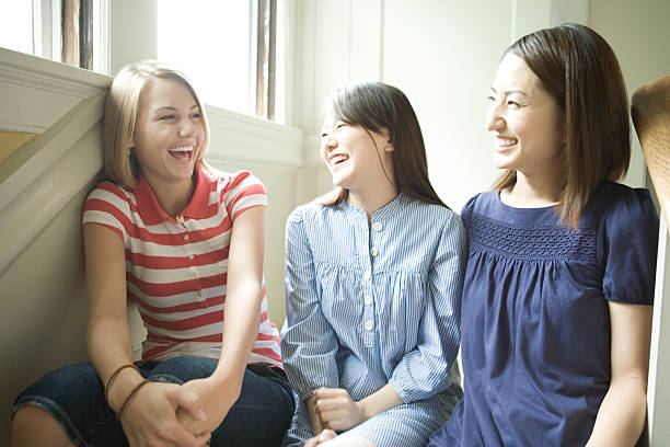 Three women talking with smile stock photo