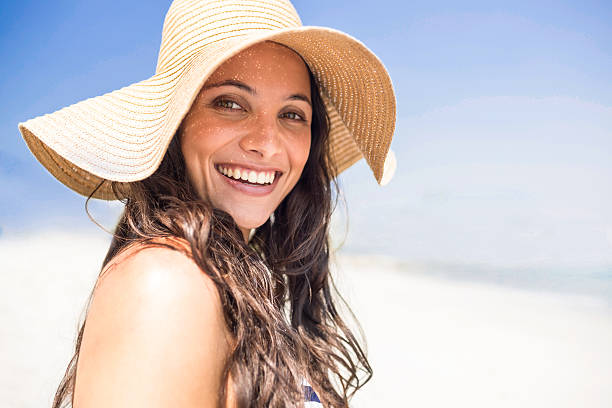 istock Pretty brunette relaxing on deck chair 482573160