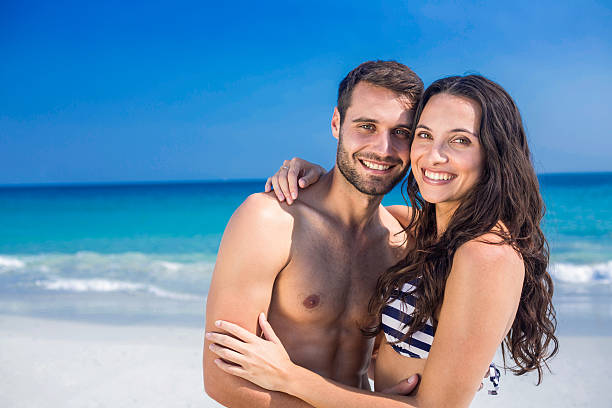 istock Happy couple embracing at the beach 482573278