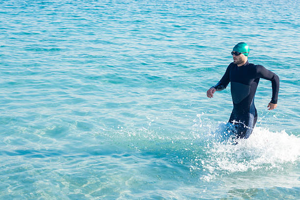 istock Swimmer running in the ocean 482573506